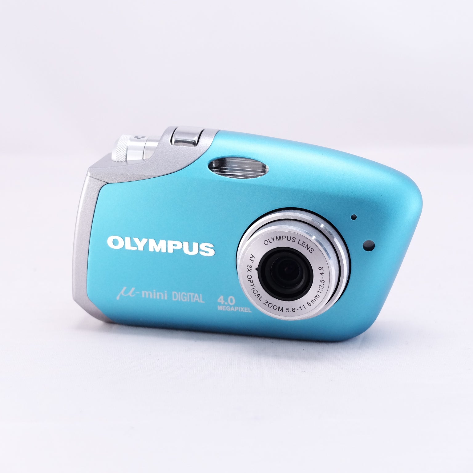OLYMPUS μ-mini DIGITAL compact camera in blue with silver accents and 4.0-megapixel lens.