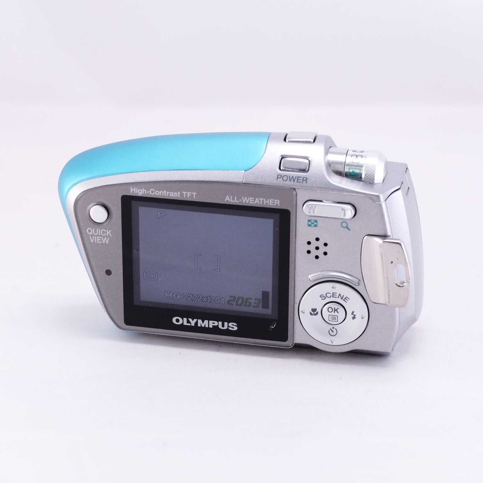 OLYMPUS μ-mini DIGITAL camera with high-contrast TFT screen, in silver and turquoise, compact design with weatherproof features.