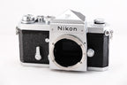 Nikon F film camera, 35mm single-lens reflex with classic design and silver finish, front view.
