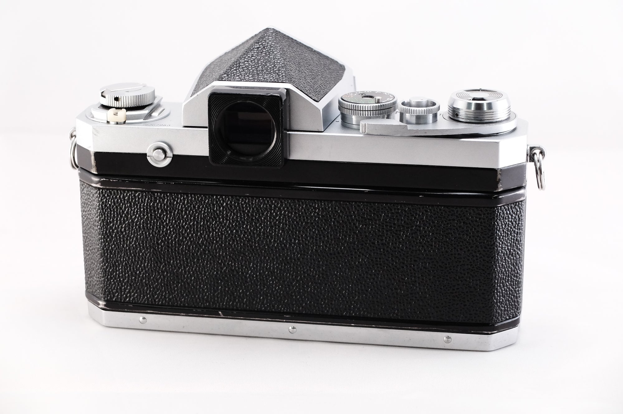 Nikon F film camera with classic black design and chrome detailing, showcasing top view features and build quality.