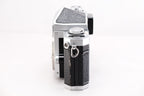 Side view of a Nikon F film camera showcasing its classic design and textured grip.
