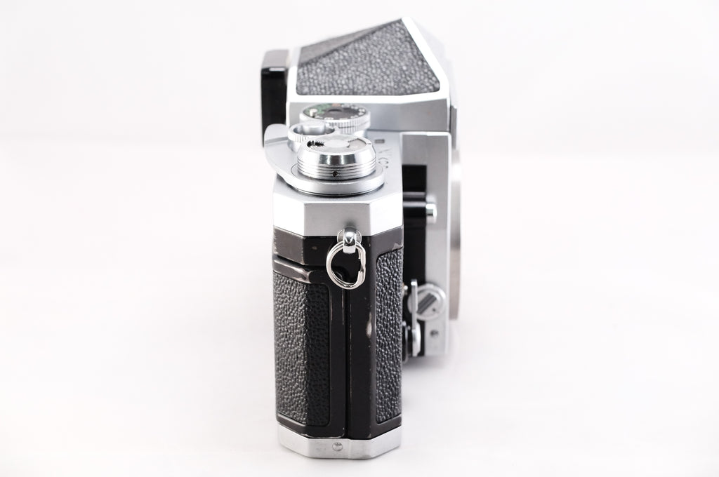 Side view of a Nikon F film camera showcasing its classic design and features.
