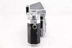 Side view of a Nikon F film camera showcasing its classic design and features.