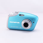 OLYMPUS μ-mini DIGITAL compact camera in blue with silver accents and 4.0-megapixel lens.